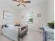 Cozy bedroom with natural light, tile flooring, and a lovely furniture set at 7206 Sw 60Th Ln, Ocala, FL 34474