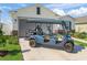Inviting home featuring a golf cart and a well-manicured lawn at 7206 Sw 60Th Ln, Ocala, FL 34474