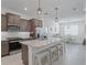 Modern kitchen with stainless steel appliances and a granite countertop island with seating at 7206 Sw 60Th Ln, Ocala, FL 34474