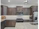 Contemporary kitchen with granite countertops, stainless steel appliances, and ample cabinet space at 7206 Sw 60Th Ln, Ocala, FL 34474