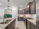 Gourmet kitchen with modern appliances, granite counters, and subway tile backsplash at 7206 Sw 60Th Ln, Ocala, FL 34474