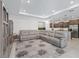 The spacious living room features a large sectional sofa, recessed lights, and seamless access to the kitchen at 7206 Sw 60Th Ln, Ocala, FL 34474