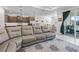 The bright living room includes tile floors, recessed lighting, and sliding glass doors to the outdoor patio at 7206 Sw 60Th Ln, Ocala, FL 34474