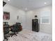 Bright office space featuring neutral walls, a large window, and a patterned rug, ideal for a workspace or study area at 7206 Sw 60Th Ln, Ocala, FL 34474