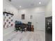 Neutral office space with tile flooring, a work desk, a safe, and a patterned rug, perfect for remote work or study at 7206 Sw 60Th Ln, Ocala, FL 34474