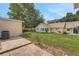 Large backyard boasts a well-maintained lawn, brick patio, and mature trees providing privacy at 8785 Sw 93Rd Ln # C, Ocala, FL 34481