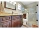 Updated bathroom featuring granite counters, dark wood cabinetry and a tile shower at 8785 Sw 93Rd Ln # C, Ocala, FL 34481