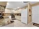 Well-equipped kitchen featuring granite countertops and white cabinetry, offering plenty of storage space at 8785 Sw 93Rd Ln # C, Ocala, FL 34481