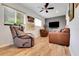 Cozy living room with multiple seating options, natural light, and vinyl plank flooring at 8785 Sw 93Rd Ln # C, Ocala, FL 34481