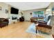 Spacious living room features hardwood floors, a modern fireplace, and ample natural light at 8785 Sw 93Rd Ln # C, Ocala, FL 34481