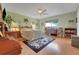 Spacious main bedroom boasts hardwood floors, a ceiling fan, and plenty of natural light at 8785 Sw 93Rd Ln # C, Ocala, FL 34481