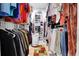 Organized walk-in closet with ample hanging space and built-in shelving for storage at 8785 Sw 93Rd Ln # C, Ocala, FL 34481