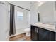 Bright bathroom with a tub-shower combo and modern fixtures at 8943 Se 41St Court Rd, Ocala, FL 34480