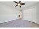Cozy bedroom featuring soft gray carpet and a spacious closet for ample storage at 8943 Se 41St Court Rd, Ocala, FL 34480