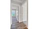 Hallway view of bedroom with neutral carpet and white trim at 8943 Se 41St Court Rd, Ocala, FL 34480