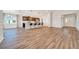Bright open floor plan boasts wood-look floors, kitchen with island seating, and modern finishes at 8943 Se 41St Court Rd, Ocala, FL 34480