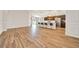 Spacious living area with wood floors, open to the kitchen with stainless steel appliances at 8943 Se 41St Court Rd, Ocala, FL 34480