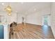 Spacious living area features wood-look floors, recessed lighting, and decorative wall trim at 8943 Se 41St Court Rd, Ocala, FL 34480