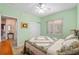 Bedroom featuring a bed with quilt bedding, closet and view to the hallway at 9408 Se 132Nd Loop, Summerfield, FL 34491