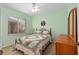Cozy bedroom with a quilt bedding and natural light at 9408 Se 132Nd Loop, Summerfield, FL 34491