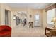 Foyer with tile flooring, decorative table, and views to living room and kitchen at 9408 Se 132Nd Loop, Summerfield, FL 34491