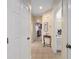Hallway view with access to several rooms including a bathroom and a bedroom at 9408 Se 132Nd Loop, Summerfield, FL 34491