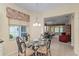 Kitchen eat-in table area featuring views into the living room, providing an open concept feel at 9408 Se 132Nd Loop, Summerfield, FL 34491