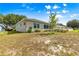 Spacious backyard offering a blank canvas for landscaping and outdoor activities at 9750 Sw 97Th Pl, Ocala, FL 34481