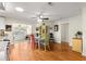 Bright dining room with hardwood floors, table and chairs, and natural light at 9750 Sw 97Th Pl, Ocala, FL 34481