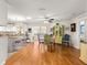 Inviting dining area with hardwood floors, colorful chairs, and a ceiling fan at 9750 Sw 97Th Pl, Ocala, FL 34481