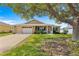 Inviting single-story home with a spacious front yard and a well-manicured lawn at 9750 Sw 97Th Pl, Ocala, FL 34481