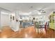 Open concept kitchen and dining area with hardwood floors and stainless steel appliances at 9750 Sw 97Th Pl, Ocala, FL 34481