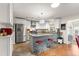 Bright kitchen with a center island, granite countertops, and stainless steel refrigerator at 9750 Sw 97Th Pl, Ocala, FL 34481