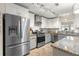 Well-equipped kitchen featuring stainless steel appliances, granite countertops, and ample cabinet space at 9750 Sw 97Th Pl, Ocala, FL 34481