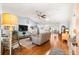 Spacious living room featuring vaulted ceilings and a seamless flow into the kitchen at 9750 Sw 97Th Pl, Ocala, FL 34481