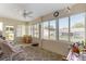 Cozy sunroom filled with natural light offers tranquil views of the backyard at 9750 Sw 97Th Pl, Ocala, FL 34481