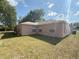 Backyard with lush green grass, offering a private retreat with ample space for recreation and outdoor activities at 1001 Ne 22Nd Ave, Ocala, FL 34470