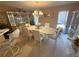 Formal dining room features a large table with seating, a china cabinet and ample natural light at 1001 Ne 22Nd Ave, Ocala, FL 34470