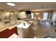 Bright open-concept kitchen with a breakfast bar flowing into dining area at 1001 Ne 22Nd Ave, Ocala, FL 34470