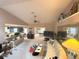 Open-concept living room boasts vaulted ceilings, neutral tones, and ample natural light, creating a spacious gathering space at 1001 Ne 22Nd Ave, Ocala, FL 34470