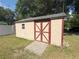 Outdoor storage shed offering additional space for tools and equipment with a charming design at 1001 Ne 22Nd Ave, Ocala, FL 34470
