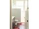 Well-lit bathroom featuring modern fixtures, wood laminate flooring and walk-in shower at 10208 Se 170 Pl, Summerfield, FL 34491