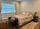 Comfortable bedroom with plush carpeting, a patterned rug, and a tufted headboard bed at 10208 Se 170 Pl, Summerfield, FL 34491