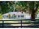 Charming single-story home with a two-car garage, well-manicured lawn, and tasteful landscaping at 10208 Se 170 Pl, Summerfield, FL 34491