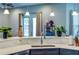 Bright kitchen features sleek countertops, stainless steel sink, and modern pendant lighting at 10208 Se 170 Pl, Summerfield, FL 34491