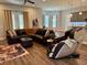 Cozy living room with leather sofa, massage chair, and modern decor at 10208 Se 170 Pl, Summerfield, FL 34491