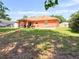 A spacious backyard featuring a charming covered patio perfect for outdoor entertaining and relaxation at 14 Dogwood Drive Radl, Ocala, FL 34472