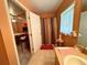 Bright bathroom with vanity, window, and view into the rest of the house at 14 Dogwood Drive Radl, Ocala, FL 34472
