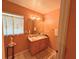 Clean bathroom features a vanity with sink and window for natural light at 14 Dogwood Drive Radl, Ocala, FL 34472