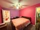 Cozy bedroom with a ceiling fan, and view of an ensuite bathroom at 14 Dogwood Drive Radl, Ocala, FL 34472